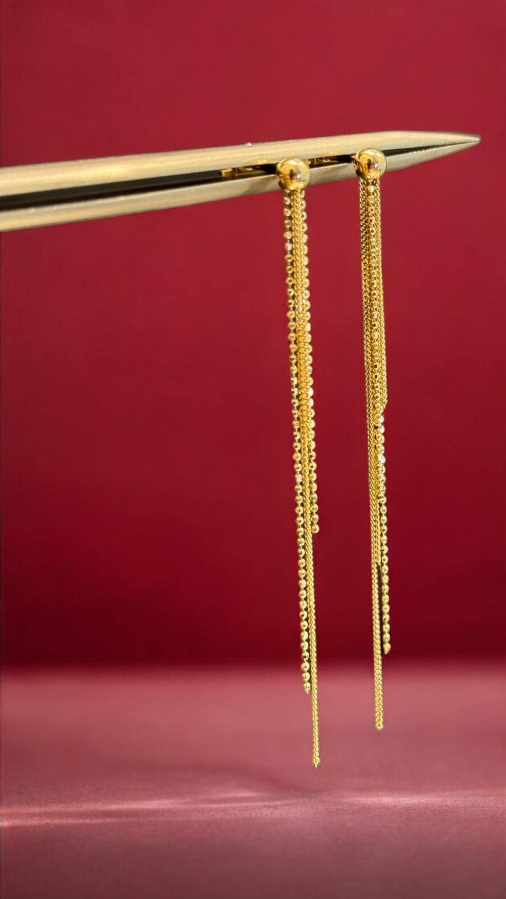 Aretes de oro colgantes