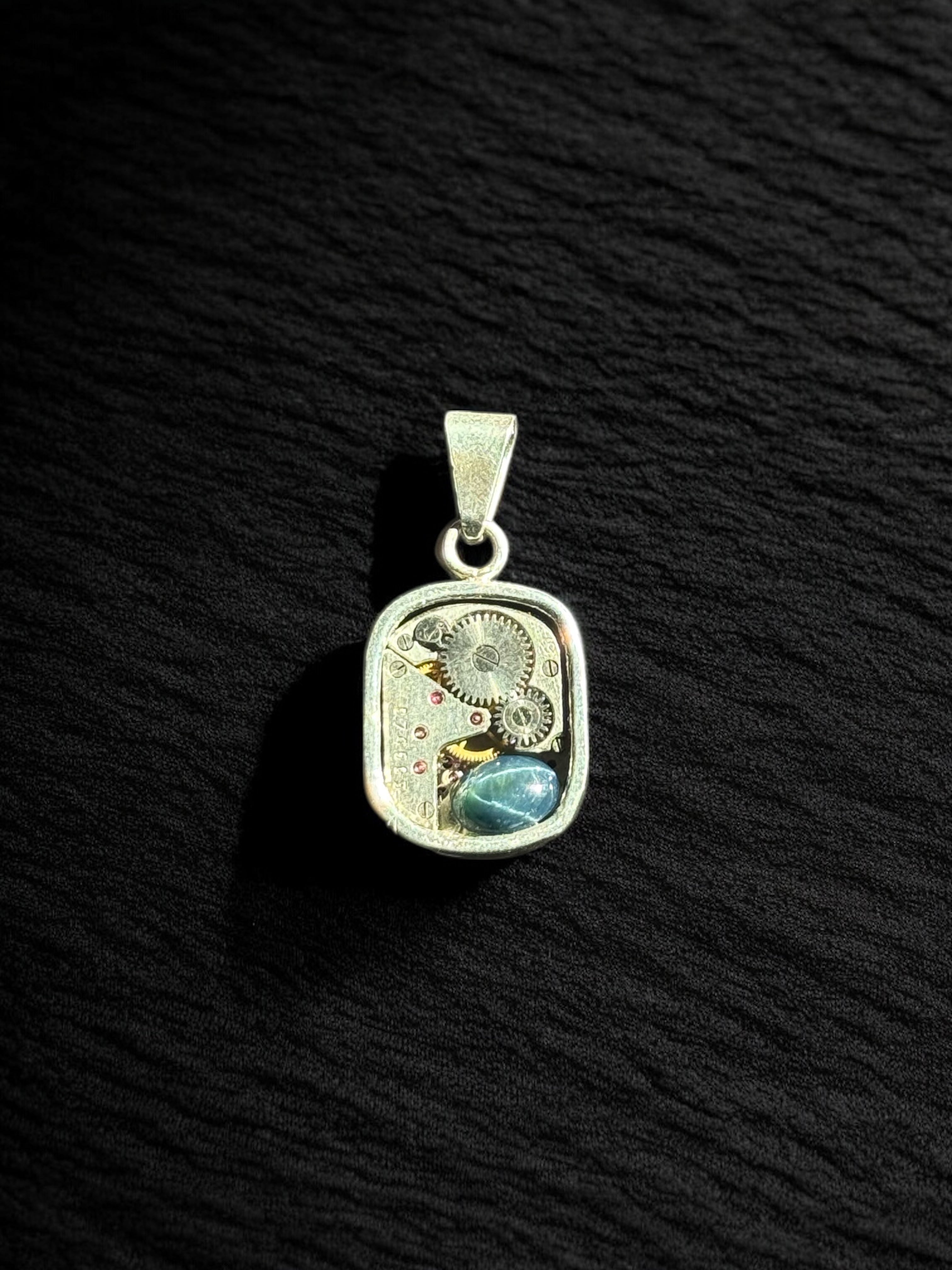 Dije reloj Zafiro estrella cabujón oval 3